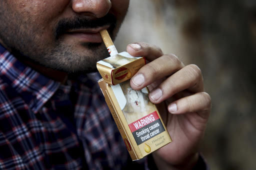 With mixed progress, nations review war vs. tobacco industry