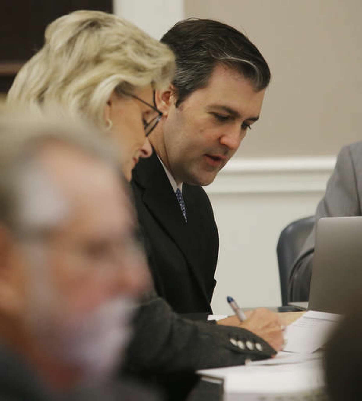Former North Charleston Police Officer Michael Slager, right, sits at the defense table during testimony in Slager's murder trial, Monday, Nov. 7, 2016, in Charleston, S.C. Slager is on trial facing a murder charge in the shooting death of Walter Scott, who was gunned down after he fled from a traffic stop. (Grace Beahm/Post and Courier via AP, Pool, File)