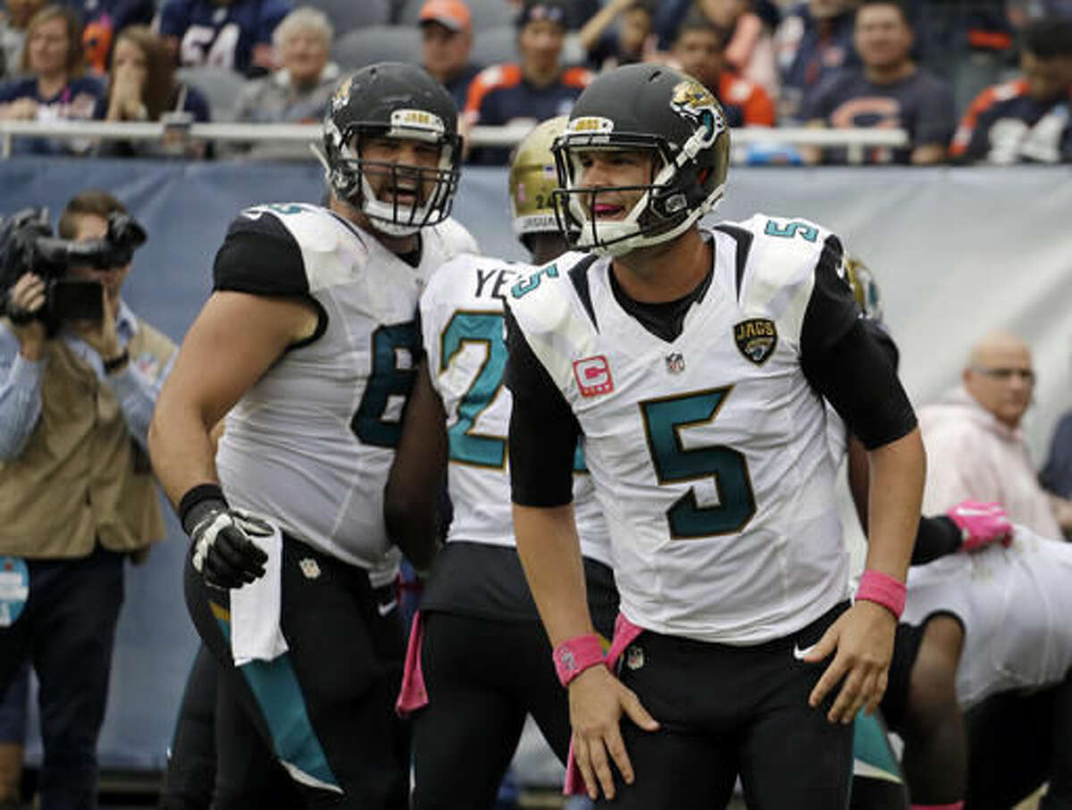 Jacksonville Jaguars quarterback Blake Bortles (5) celebrates a touchdown against the Chicago Bears during the second half of an NFL football game in Chicago, Sunday, Oct. 16, 2016. (AP Photo/Jeff Roberson)