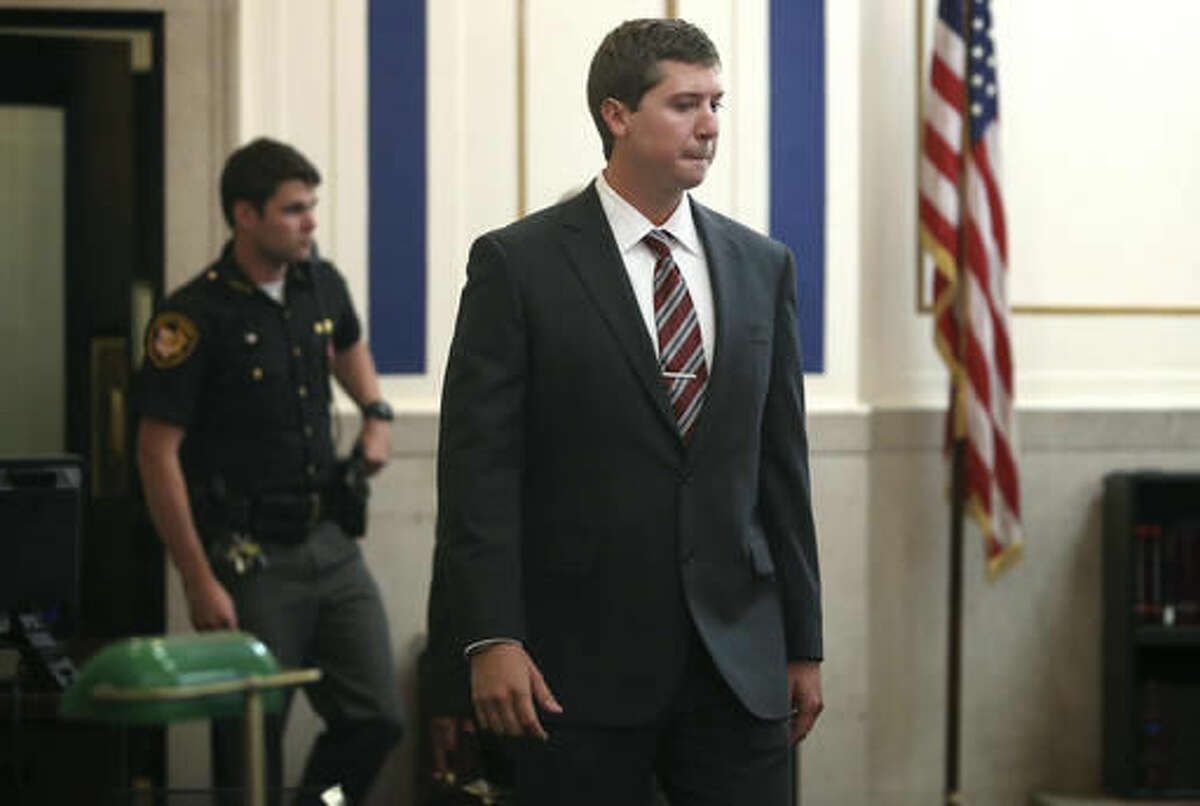 Ray Tensing enters Judge Megan Shanahan's courtroom for his pre-trial hearing on Friday, Oct. 14, 2016, in Cincinnati. The former University of Cincinnati police officer is charged with killing Sam DuBose, an unarmed black man during a traffic stop over a missing front license plate. (Amanda Rossmann/The Philadelphia Inquirer via AP, Pool)