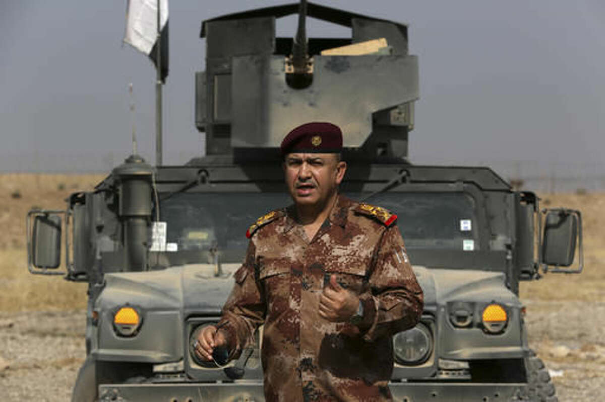The Commander of the Joint Military Operation Commander, Army Lt. Gen. Talib Shaghati, speaks during an interview with The Associated Press in in the town of Khazer, Iraq, Monday, Oct. 17, 2016. He praised the role of the U.S.-led International Coalition as "very important" through carrying out airstrikes and sharing intelligence. Citing intelligence information, he claimed some IS militants were fleeing Mosul to Syria along with their families. (AP Photo/Khalid Mohammed)