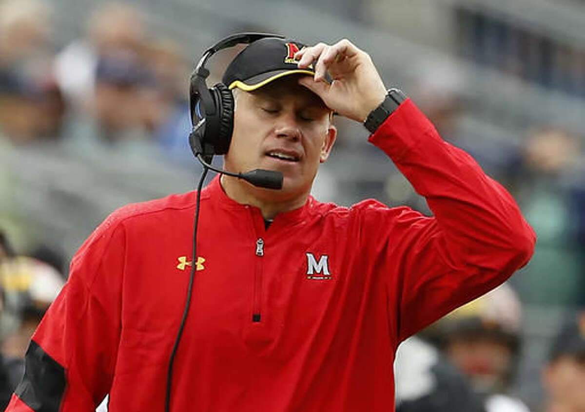 FILE - In this Oct. 8, 2016, file photo, Maryland head coach DJ Durkin reacts after Penn State scores during the second half of an NCAA college football game in State College, Pa. Maryland's offense has sputtered the last two games, and the cure might go beyond merely getting back injured quarterback Perry Hills. (AP Photo/Chris Knight, File)
