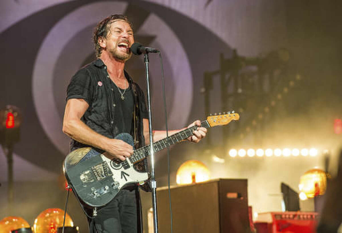 FILe - In this June 11, 2016, file photo, Eddie Vedder of Pearl Jam performs at Bonnaroo Music and Arts Festival in Manchester, Tenn. The late rapper Tupac Shakur and Seattle-based rockers Pearl Jam are among the first-time nominees on the ballot for induction next year into the Rock and Roll Hall of Fame. (Photo by Amy Harris/Invision/AP, File)