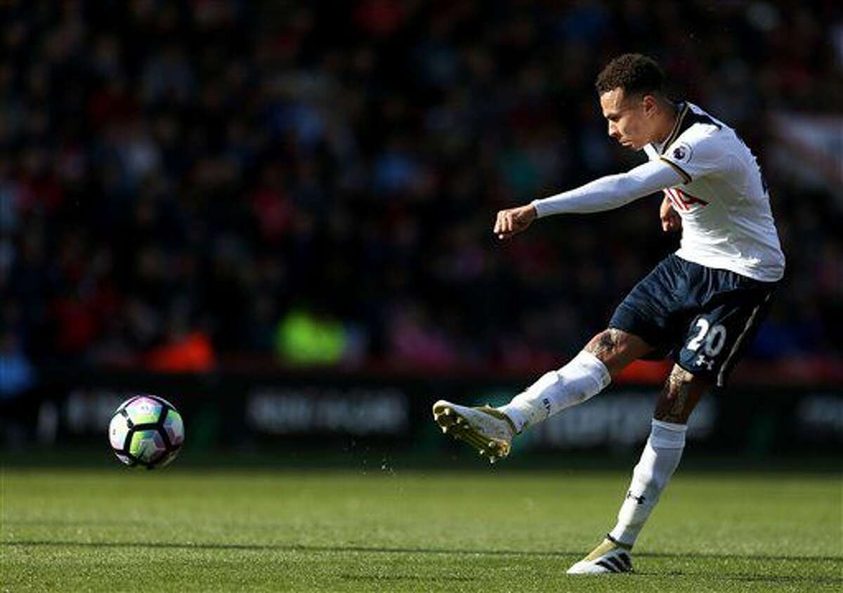 Tottenham Hotspur's Dele Alli takes a shot during the English Premier League soccer match between AFC Bournemouth and Tottenham Hotspur at the Vitality Stadium, Bournemouth, England, Saturday, Oct. 22, 2016. (Steve Paston/PA via AP)