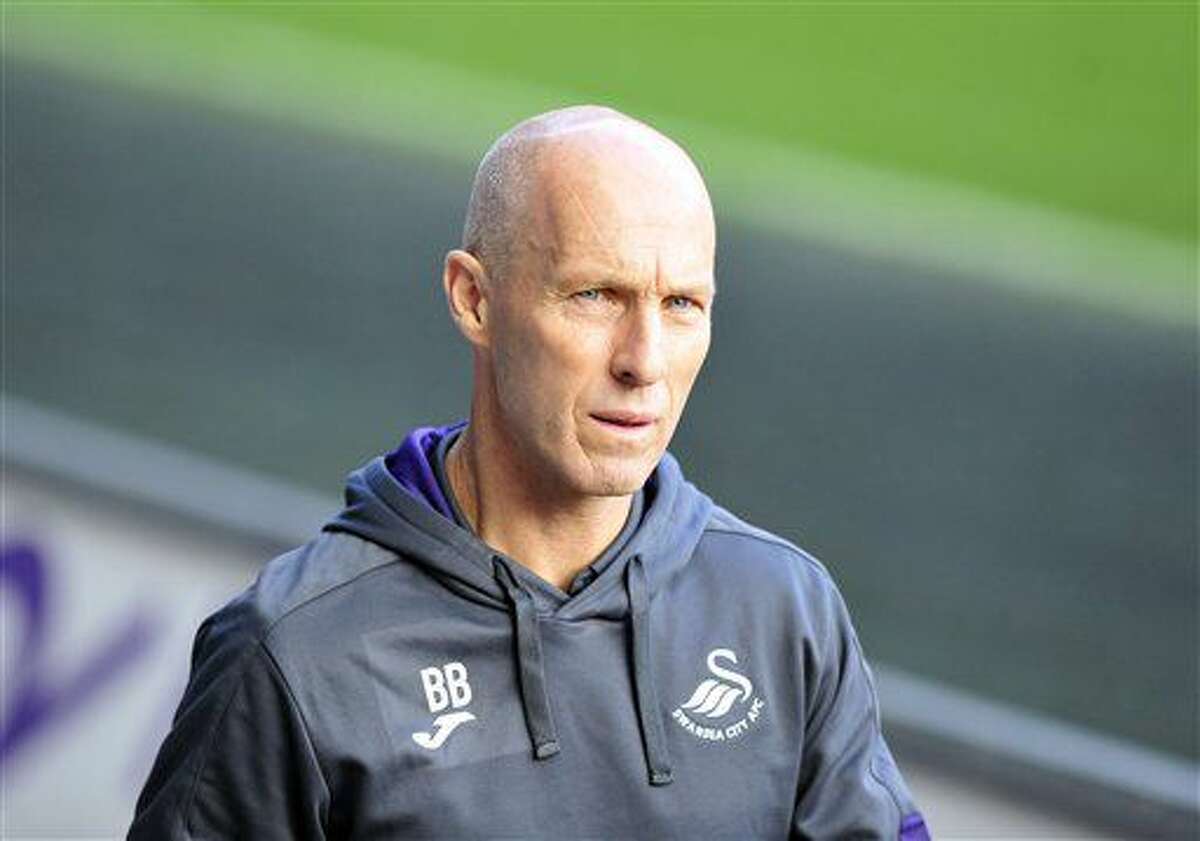 Swansea City Manger Bob Bradley walks beside the pitch before the English Premier League soccer match between Swansea City and Watford at the Liberty Stadium, Swansea, Wales, Saturday, Oct. 22, 2016. (Simon Galloway/PA via AP)