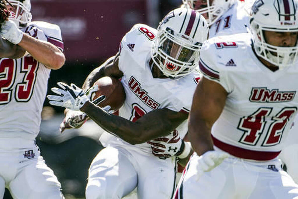 Massachusetts running back Marquis Young (8) carries the ball against the South Carolina defense during the first half of an NCAA college football game Saturday, Oct. 22, 2016, in Columbia, S.C. (AP Photo/Sean Rayford)