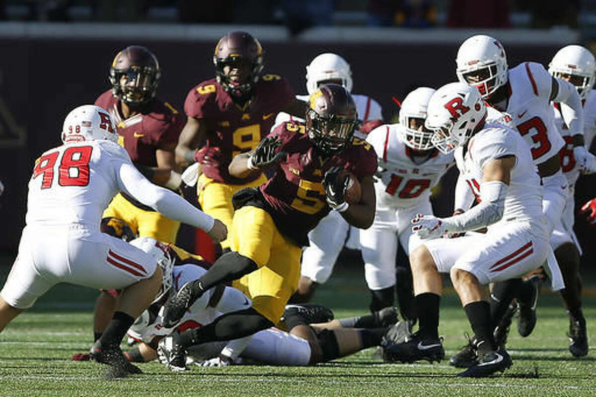 Minnesota wide receiver Melvin Holland Jr. breaks through Rutgers defense during the first half of an NCAA college football game Saturday, Oct. 22, 2016, in Minneapolis. (AP Photo/Stacy Bengs)