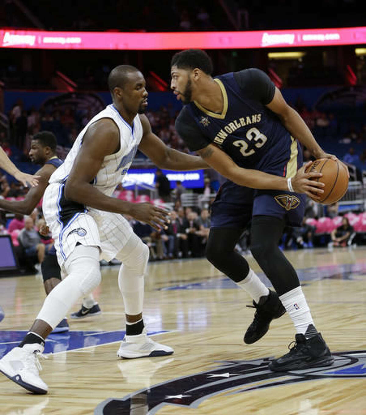 New Orleans Pelicans' Anthony Davis (23) makes a move to get to the basket around Orlando Magic's Serge Ibaka during the first half of an NBA basketball game, Thursday, Oct. 20, 2016, in Orlando, Fla. (AP Photo/John Raoux)