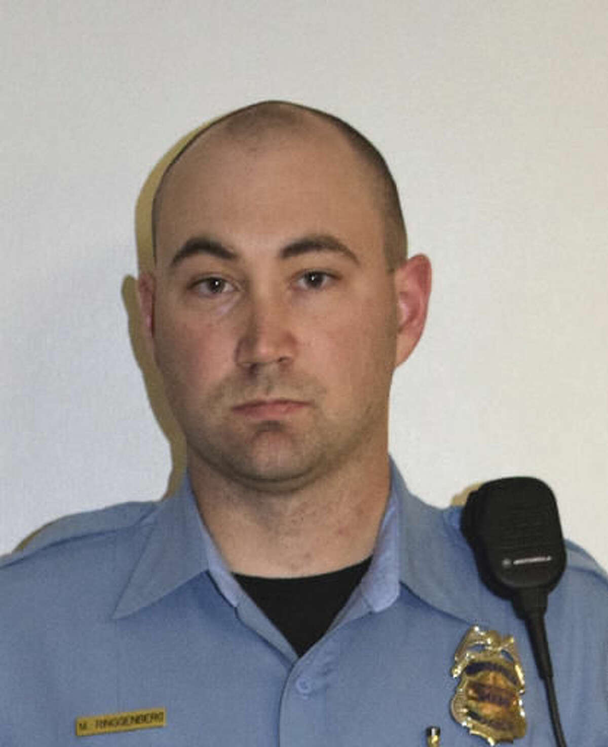 FILE - This undated file photo provided by the Minneapolis Police Department shows Officer Mark Ringgenberg. Officers Ringgenberg and Dustin Schwarze, two white police officers, were involved in the fatal shooting of a black man last fall. The officers followed proper procedure in a confrontation that led to the fatal shooting of Jamar Clark in November, and won't face discipline, the city's police chief announced Friday, Oct. 21, 2016. (Minneapolis Police Department via AP, File)