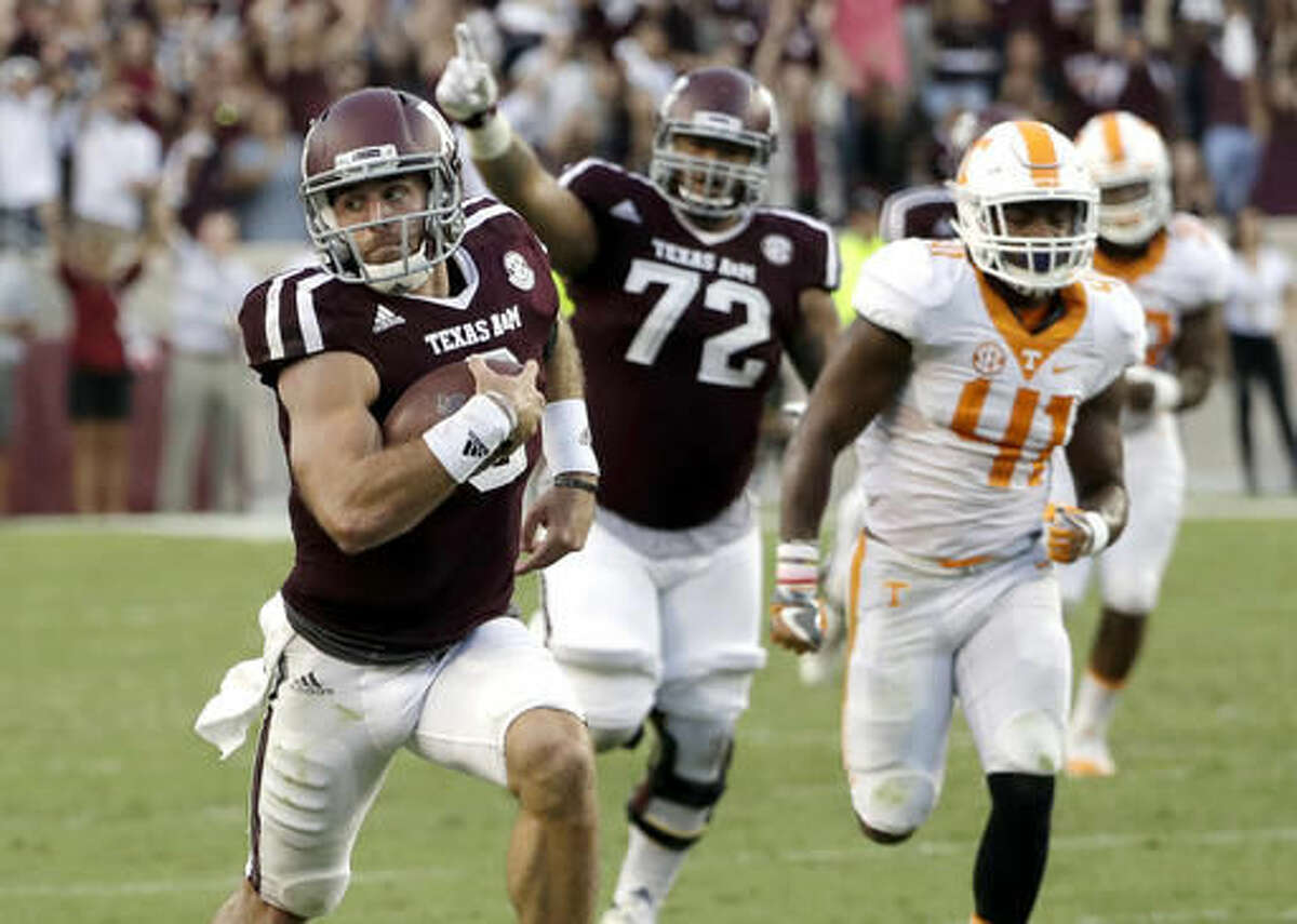 FILE - In this Saturday, Oct. 8, 2016, file photo, Texas A&M quarterback Trevor Knight (8) rushes for a touchdown against Tennessee during the second half of an NCAA college football game in College Station, Texas. Knight could get the beat-Bama bump in the Heisman trace with a big game in Tuscaloosa. (AP Photo/David J. Phillip, File)