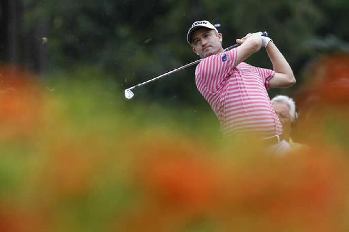 Russell Knox of Scotland follows his shot on the eighth hole during the third round of the CIMB Classic golf tournament at Tournament Players Club in Kuala Lumpur, Malaysia, Saturday, Oct. 22, 2016. (AP Photo/Joshua Paul)