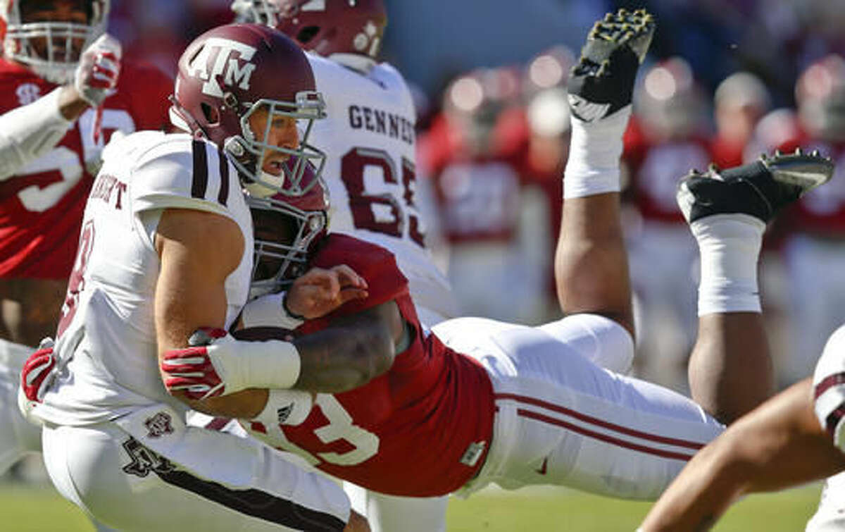 Alabama defensive lineman Jonathan Allen (93) sacks Texas A&M quarterback Trevor Knight, front left, during the first half of an NCAA college football game, Saturday, Oct. 22, 2016, in Tuscaloosa, Ala. (AP Photo/Brynn Anderson)