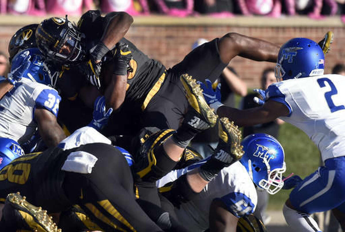 Missouri running back Damarea Crockett scores on a 2-yard run during the first half of an NCAA college football game against Middle Tennessee, Saturday, Oct. 22, 2016, in Columbia, Mo. (AP Photo/L.G. Patterson)