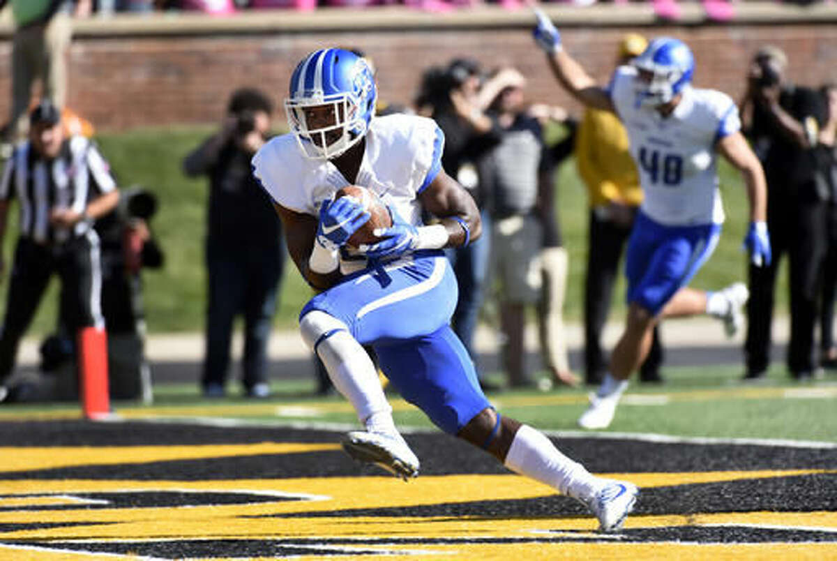 Middle Tennessee wide receiver Dennis Andrews, left, catches a touchdown pass as teammate Max Linder celebrates in the background during the first half of an NCAA college football game against Missouri, Saturday, Oct. 22, 2016, in Columbia, Mo. (AP Photo/L.G. Patterson)