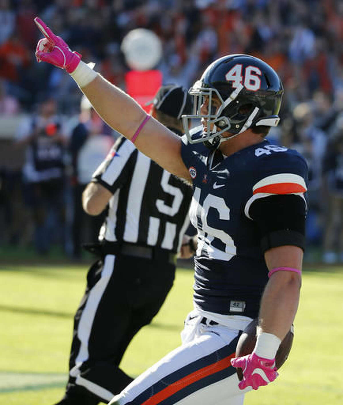 Virginia tight end Evan Butts (46) celebrates a touchdown catch during the first half of an NCAA college football game between North Carolina and Virginia at Scott stadium in Charlottesville, Va., Saturday, Oct. 22, 2016. (AP Photo/Steve Helber)
