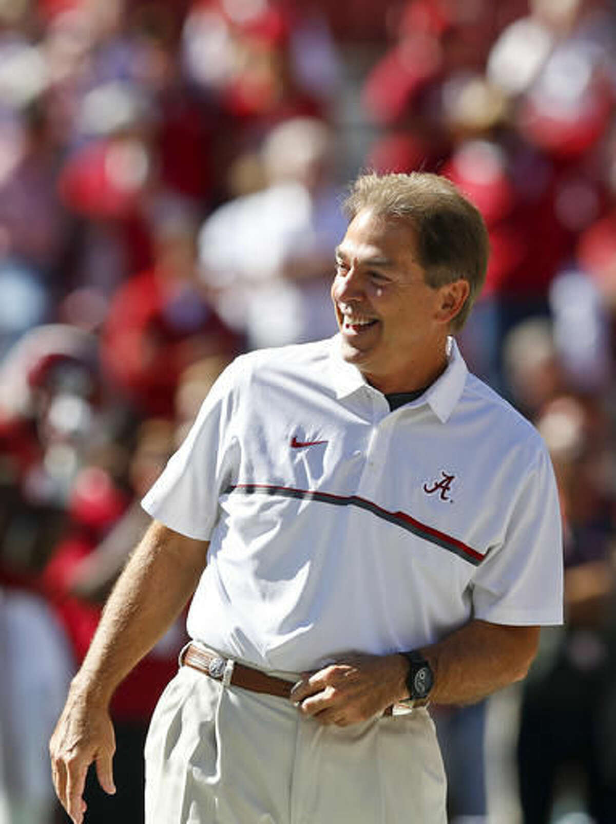 Alabama head coach Nick Saban laughs in the middle of the field before an NCAA college football game against Texas A&M, Saturday, Oct. 22, 2016, in Tuscaloosa, Ala. (AP Photo/Brynn Anderson)