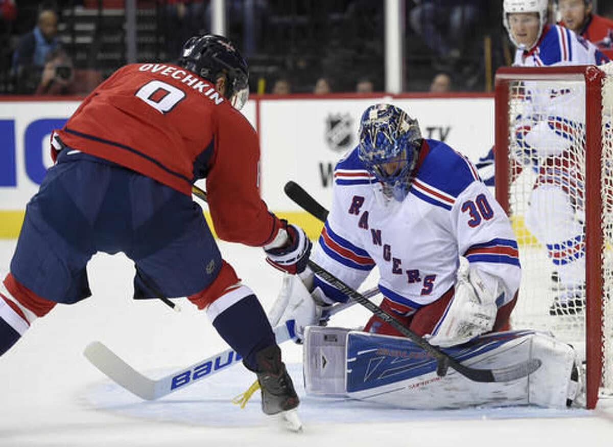 New York Rangers goalie Henrik Lundqvist (30), of Sweden, stops Washington Capitals left wing Alex Ovechkin (8), of Russia, during the second period of an NHL hockey game, Saturday, Oct. 22, 2016, in Washington. (AP Photo/Nick Wass)