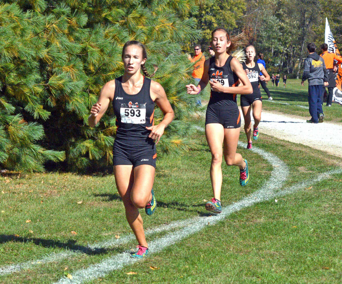 Edwardsville’s Melissa Spencer (No. 593) and Jaycie Hudson run in the girls’ race.