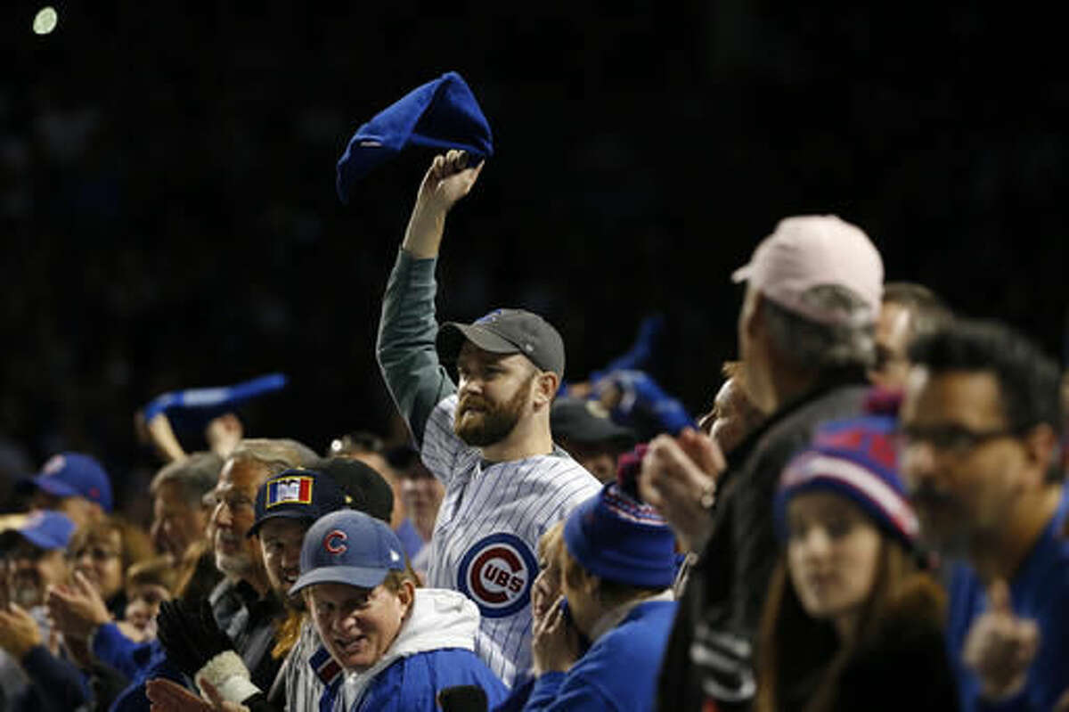 Chicago Cubs fans cheer during the ninth inning of Game 6 of the National League baseball championship series against the Los Angeles Dodgers, Saturday, Oct. 22, 2016, in Chicago. (AP Photo/Nam Y. Huh)
