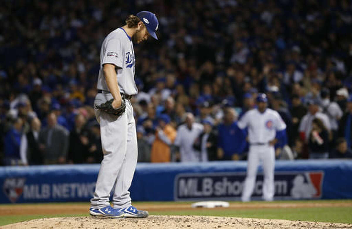 Los Angeles Dodgers starting pitcher Clayton Kershaw (22) looks down as he pitches during the fourth inning of Game 6 of the National League baseball championship series against the Chicago Cubs, Saturday, Oct. 22, 2016, in Chicago. (AP Photo/Nam Y. Huh)
