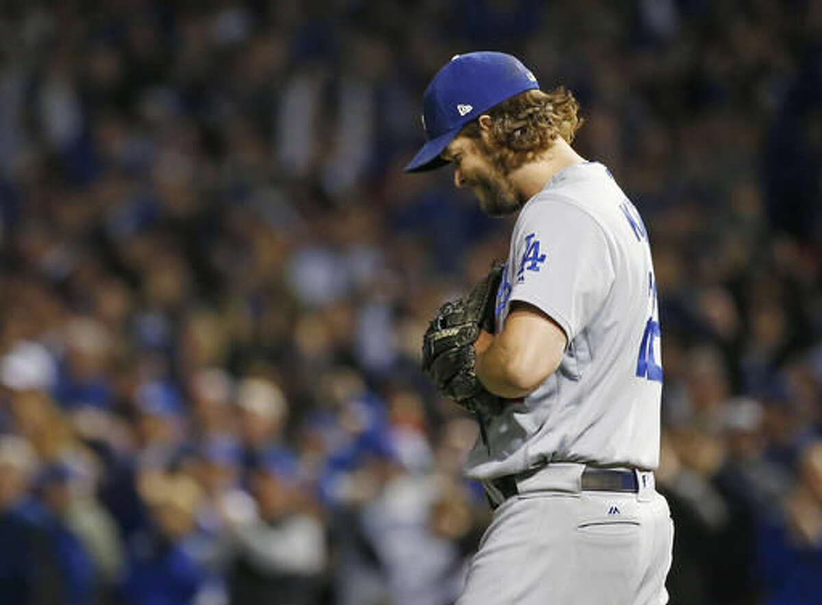 Los Angeles Dodgers starting pitcher Clayton Kershaw (22) reacts after Chicago Cubs shortstop Addison Russell (27) hits a double during the second inning of Game 6 of the National League baseball championship series Saturday, Oct. 22, 2016, in Chicago. (AP Photo/Nam Y. Huh)
