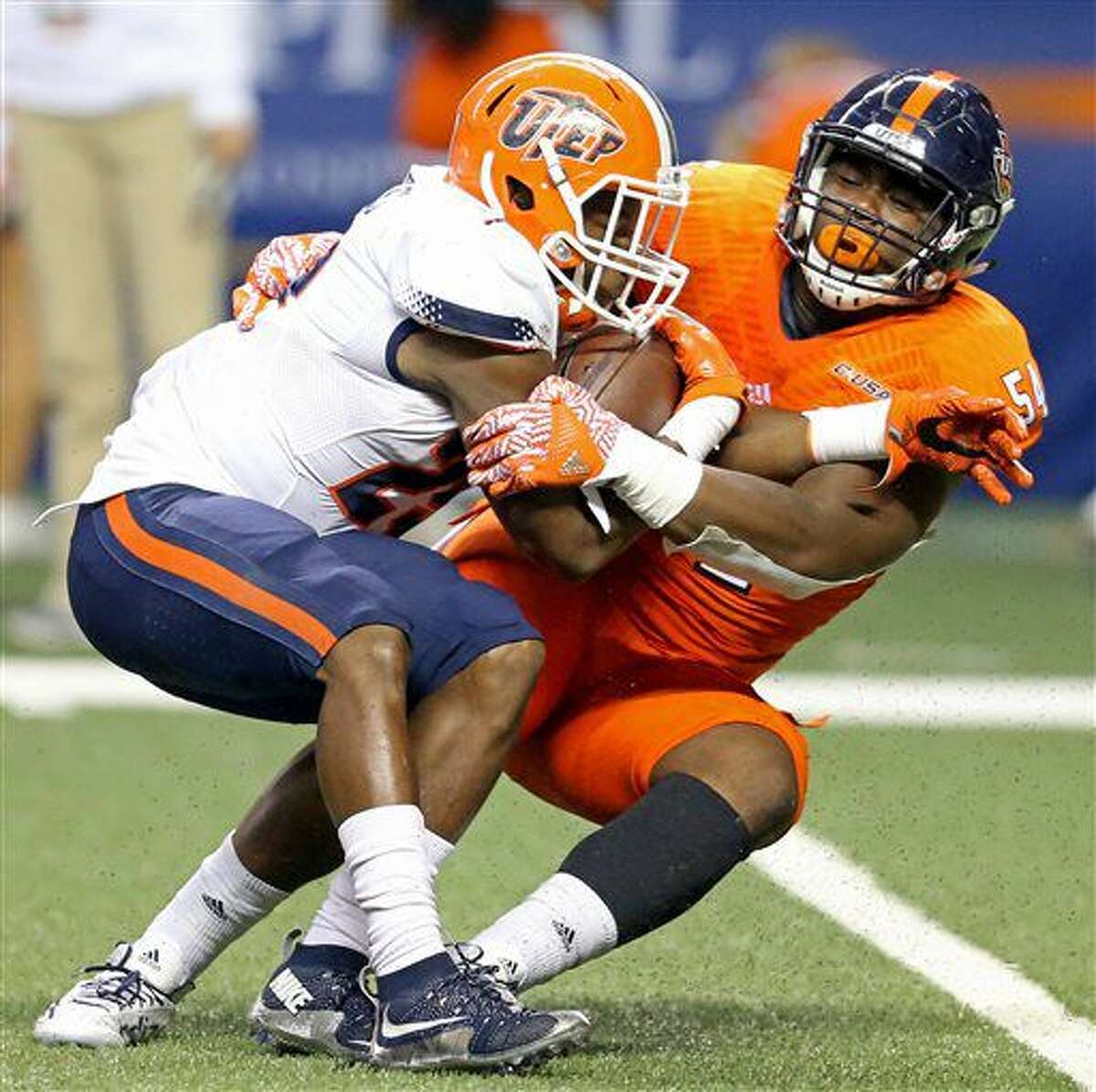 UTEP running back Aaron Jones (29) is tackled by UTSA defensive end Kevin Strong Jr. (54) during the first half of an NCAA college football game, Saturday, Oct. 22, 2016, in San Antonio. (Edward A. Ornelas/San Antonio Express-News via AP)