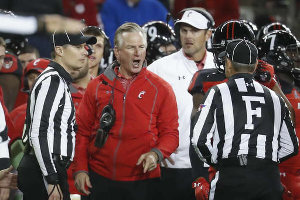 Cincinnati head coach Tommy Tuberville, center, reacts on the sidelines towards the referees during the second half of an NCAA college football game against East Carolina, Saturday, Oct. 22, 2016, in Cincinnati. Cincinnati won 31-19. (AP Photo/John Minchillo)