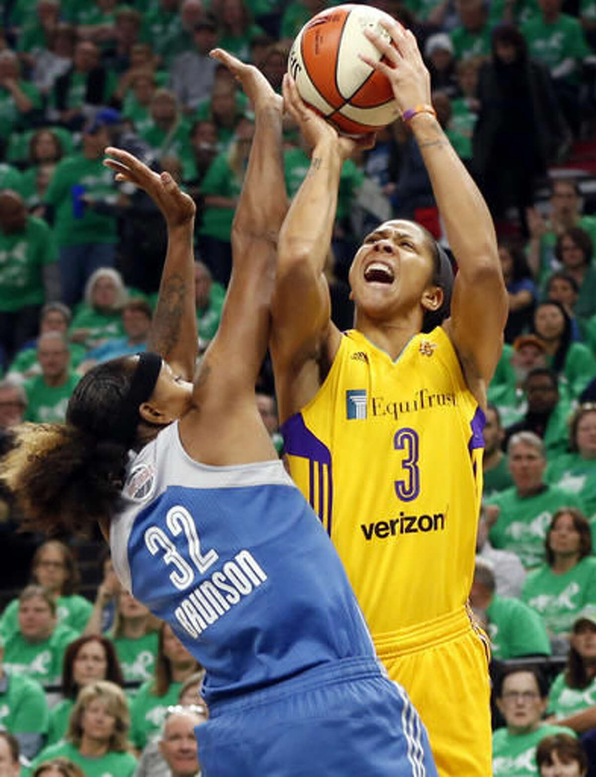 Los Angeles Sparks' Candace Parker, right, attempts to shoot over Minnesota Lynx's Rebekkah Brunson in the first quarter during Game 5 of the WNBA basketball finals Thursday, Oct. 20, 2016, in Minneapolis. (AP Photo/Jim Mone)