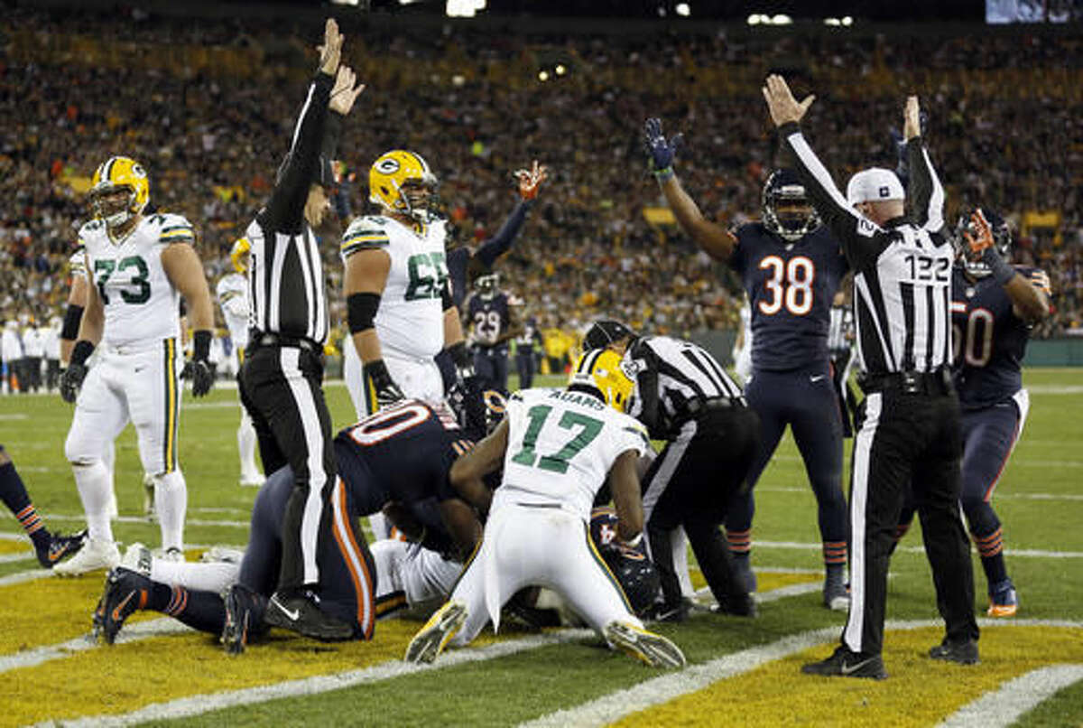 Chicago Bears players celebrate after outside linebacker Leonard Floyd (94) recovers a fumble by Green Bay Packers quarterback Aaron Rodgers (12) for a touchdown during the second half of an NFL football game, Thursday, Oct. 20, 2016, in Green Bay, Wis. (AP Photo/Matt Ludtke)