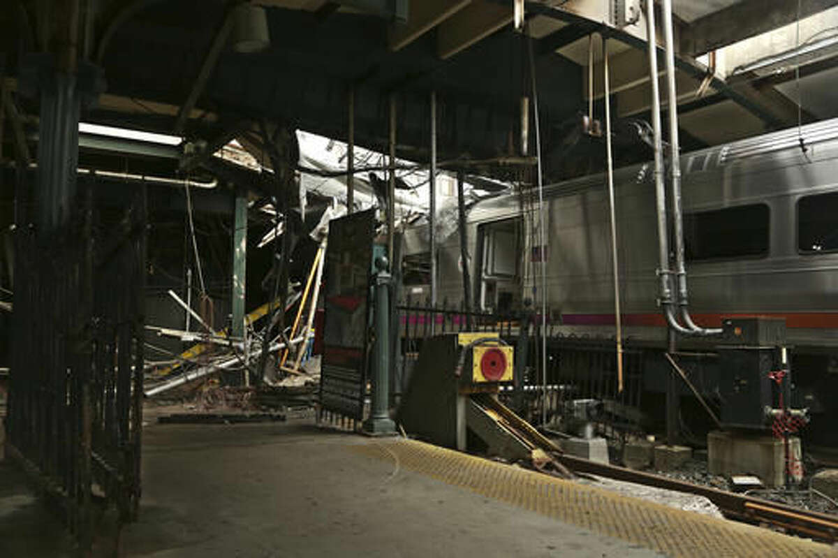 FILE - This Oct. 1, 2016, file photo provided by the National Transportation Safety Board shows damage done to the Hoboken Terminal in Hoboken, N.J., after a commuter train crash that killed one person and injured more than 100 others last week. Lawmakers investigating New Jersey Transit are expected to focus on the role modern safety technology could have played in preventing last month's deadly crash. Friday's hearing on Oct. 21, 2016, in Trenton comes after an Associated Press report found that NJ Transit had more accidents and paid more safety fines than any other commuter railroad since 2011. (Chris O'Neil/NTSB photo via AP, File)