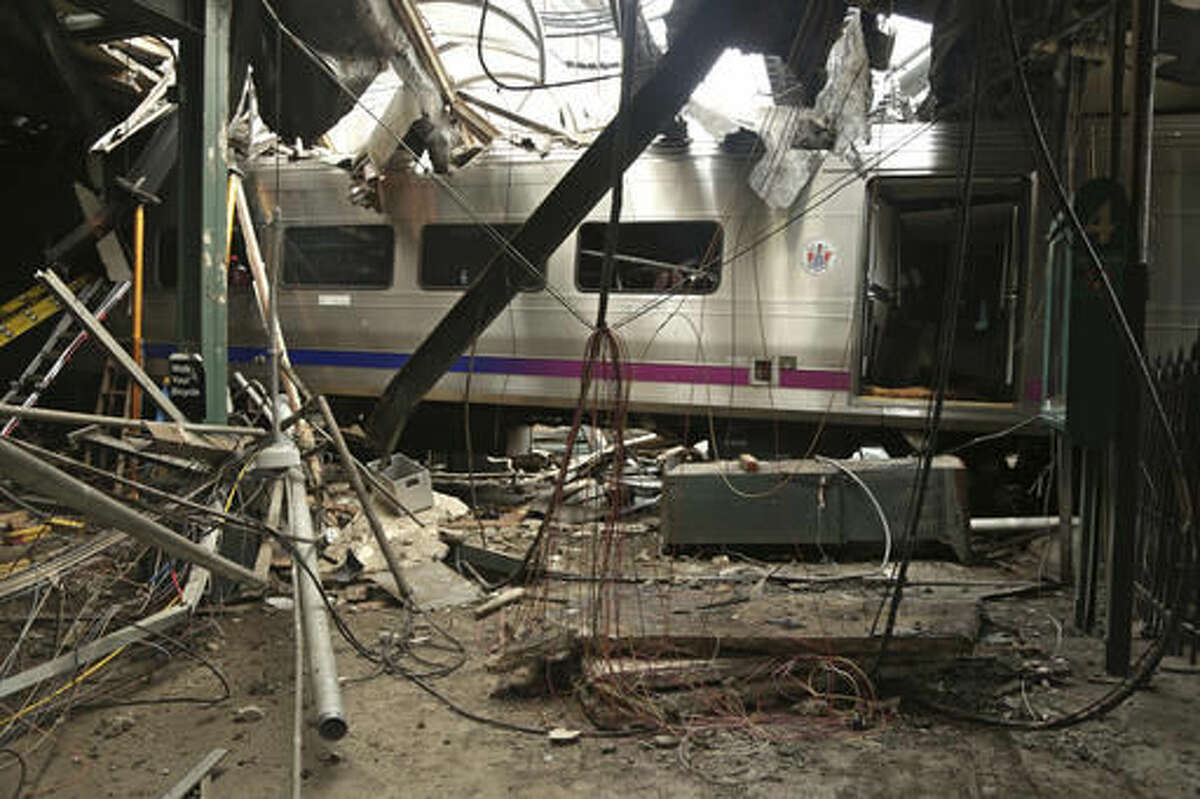 FILE - This Oct. 1, 2016, file photo provided by the National Transportation Safety Board shows damage done to the Hoboken Terminal in Hoboken, N.J., after the Sept. 29 commuter train crash. Lawmakers investigating New Jersey Transit are expected to focus on the role modern safety technology could have played in preventing last month's deadly crash. Friday's hearing on Oct. 21, 2016, in Trenton comes after an Associated Press report found that NJ Transit had more accidents and paid more safety fines than any other commuter railroad since 2011. (Chris O'Neil/NTSB photo via AP, File)