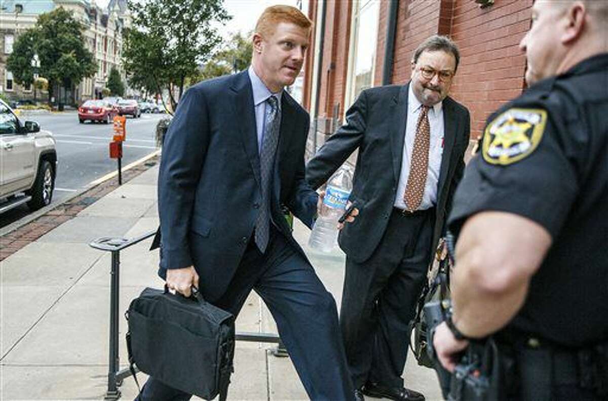 Former Penn State football assistant coach Mike McQueary arrives, Thursday, Oct. 20, 2016 at Centre County court in Bellefonte, Pa. Former Penn State President Graham Spanier testified Thursday that he issued a statement the day two of his top lieutenants were charged in the Jerry Sandusky child sexual abuse scandal, calling the allegations against them groundless, because he had developed deep trust in them. (Dan Gleiter/PennLive.com via AP)