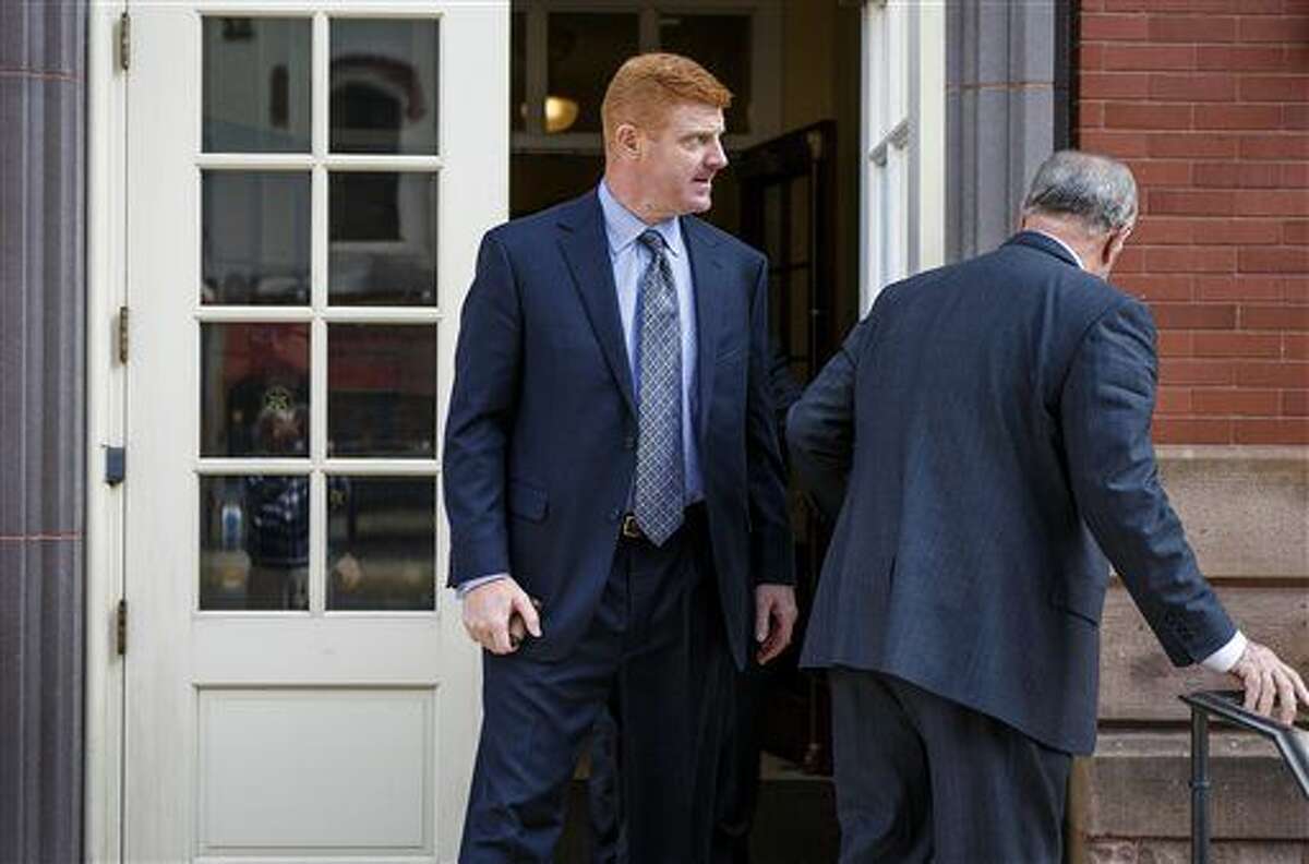 Former Penn State football assistant coach Mike McQueary takes a lunch break, Thursday, Oct. 20, 2016 at Centre County court in Bellefonte, Pa. Former Penn State President Graham Spanier testified Thursday that he issued a statement the day two of his top lieutenants were charged in the Jerry Sandusky child sexual abuse scandal, calling the allegations against them groundless, because he had developed deep trust in them. (Dan Gleiter/PennLive.com via AP)