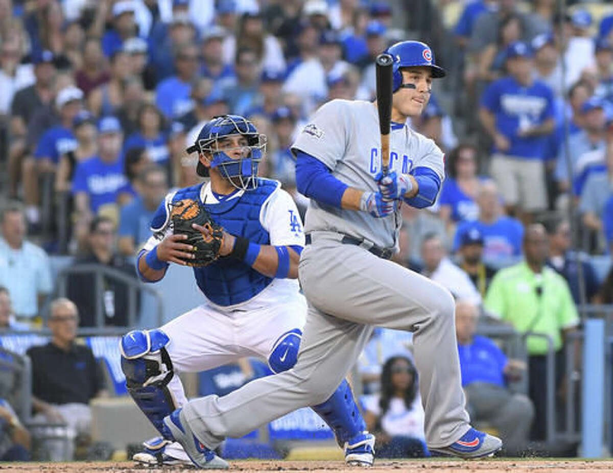 Chicago Cubs' Anthony Rizzo hits an RBI double during the first inning of Game 5 of the National League baseball championship series against the Los Angeles Dodgers Thursday, Oct. 20, 2016, in Los Angeles. (AP Photo/Mark J. Terrill)