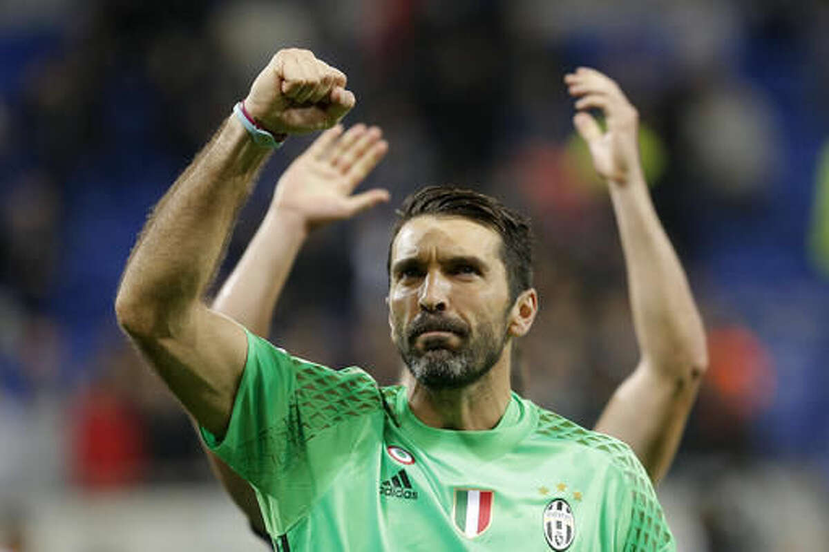 Juventus goalkeeper Gianluigi Buffon clenches his fist after the Champions League Group H soccer match against Lyon, Tuesday Oct. 18, 2016, in Lyon, central France. Juventus won 1-0. (AP Photo/Laurent Cipriani)