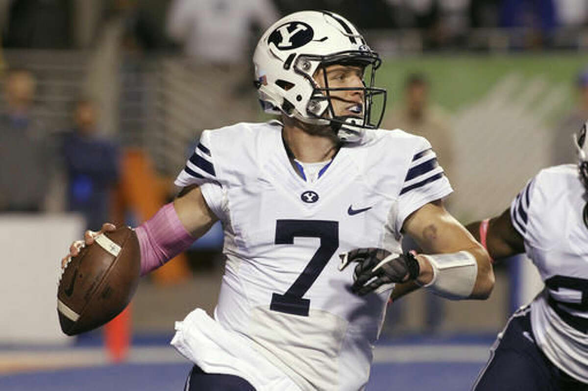 BYU quarterback Taysom Hill looks to pass during the first half of an NCAA college football game against Boise State in Boise, Idaho, Thursday, Oct. 20, 2016. (AP Photo/Otto Kitsinger)