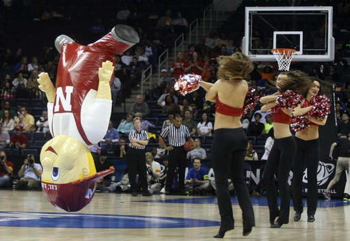FILE - In this March 31, 2013, file photo, The Nebraska Lil' Red mascot performs during a regional semi-final game at the women's NCAA college basketball tournament in Norfolk, Va. Lil Red is among the 10 pro and seven collegiate mascots have been inducted into the Mascot Hall of Fame will be built in Whiting, Ind. (AP Photo/Jason Hirschfeld, File)