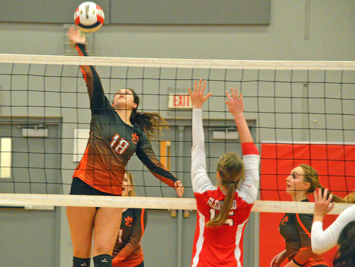 Edwardsville sophomore Corrine Timmerman goes up for a kill during Tuesday’s match against Chatham Glenwood in the semifinals of the Class 4A Alton Regional.