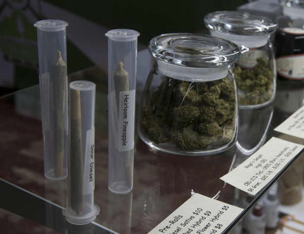 In this Thursday, Oct. 13, 2016 photo, marijuana products, including pre-rolled cigarettes and buds are displayed at the medical marijuana dispensary owned by Tim Blake near Laytonville, Calif. Blake supports the passage of Proposition 64, the November ballot initiative which would legalize the recreational use of marijuana, saying it's the next big step for an industry emerging from the shadows. (AP Photo/Rich Pedroncelli)