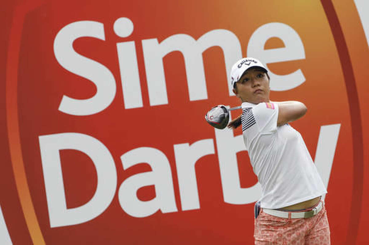 Lydia Ko of New Zealand follows her shot on the eighth hole during the first round of the LPGA golf tournament at Tournament Players Club (TPC) in Kuala Lumpur, Malaysia, Thursday, Oct. 27, 2016. (AP Photo/Joshua Paul)