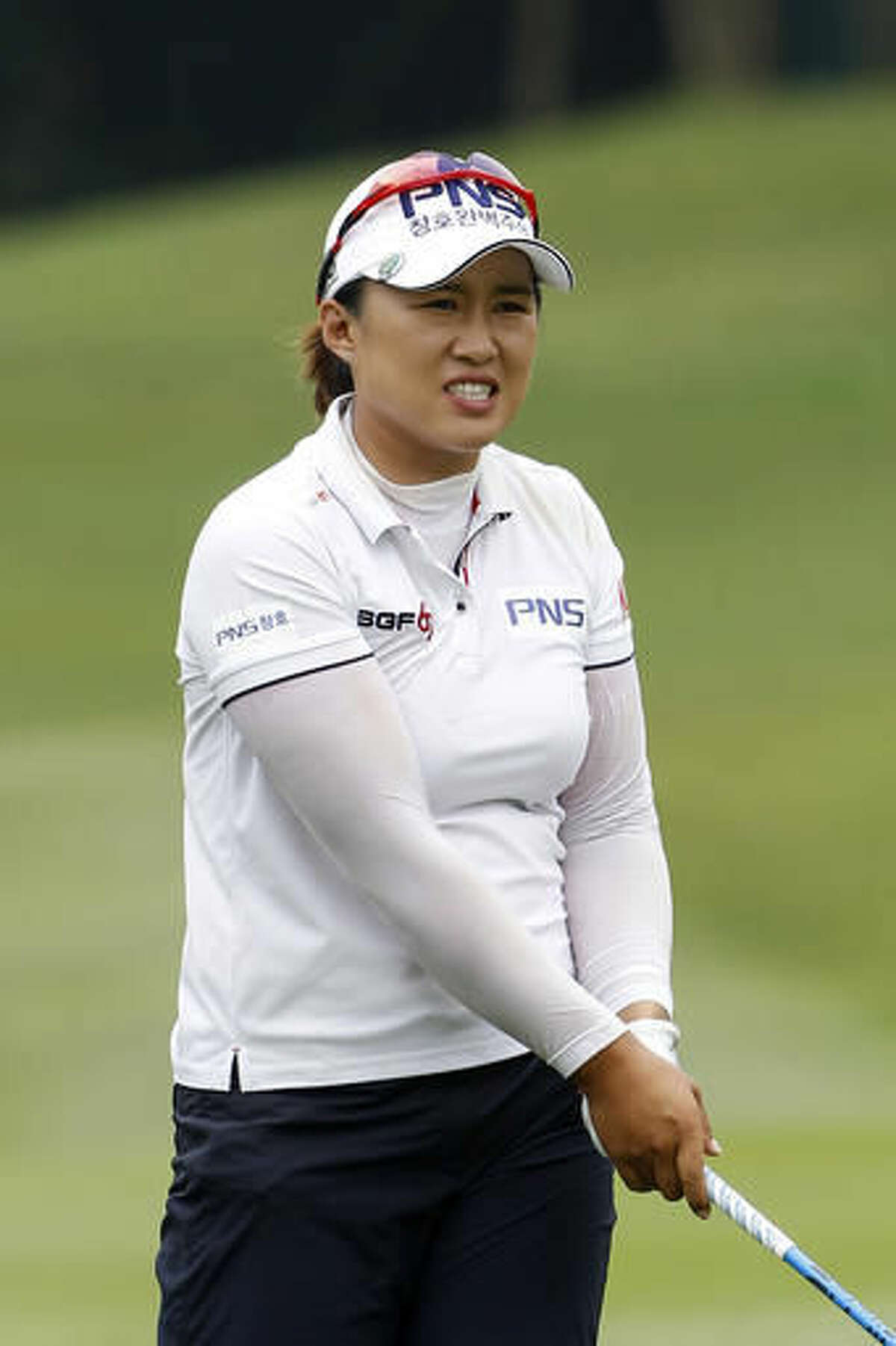 Amy Yang of South Korea reacts after hitting her shot on the 12th hole during the first round of the LPGA golf tournament at Tournament Players Club (TPC) in Kuala Lumpur, Malaysia, Thursday, Oct. 27, 2016. (AP Photo/Joshua Paul)