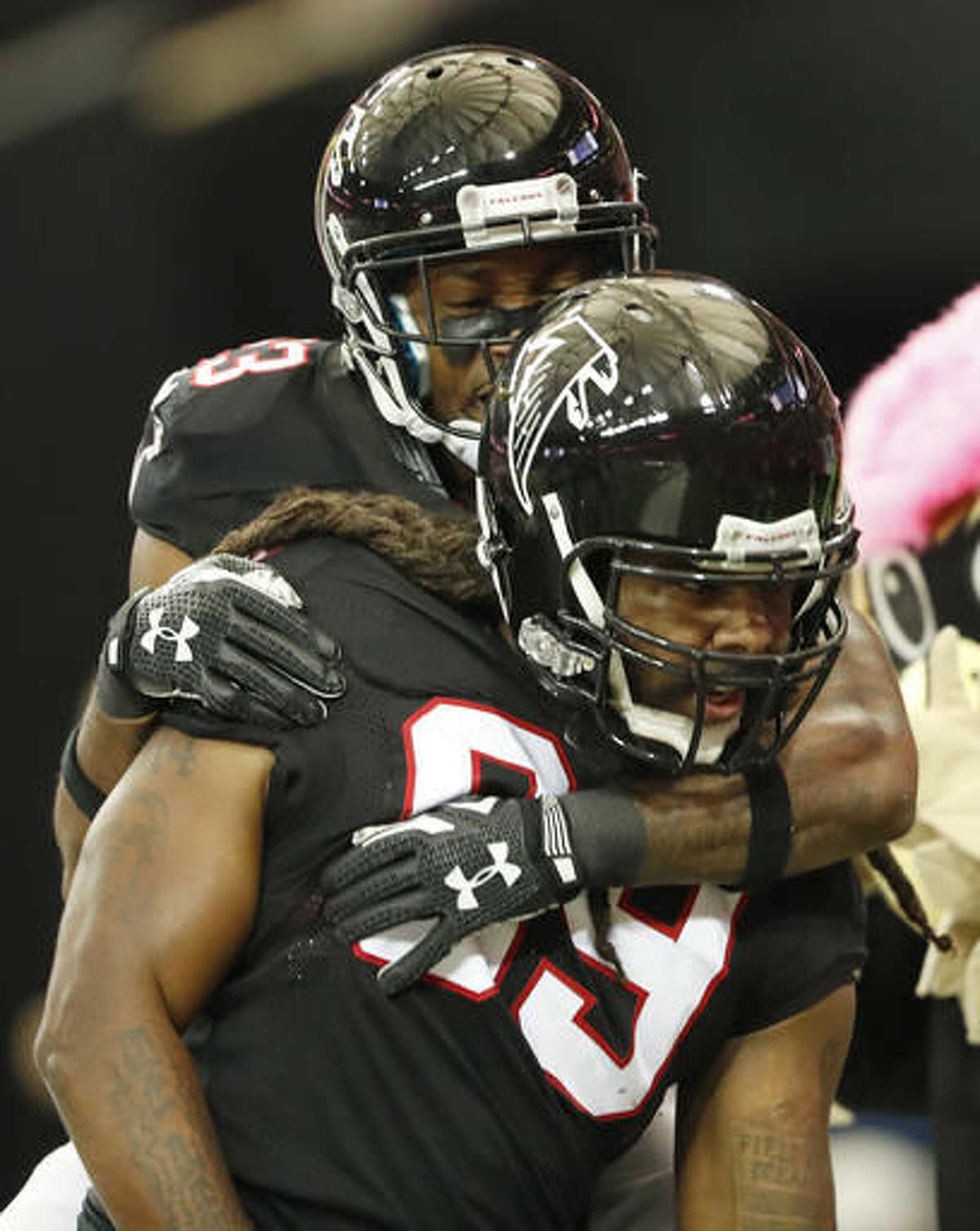 Atlanta Falcons defensive end Adrian Clayborn (99) celebrates with team mates after he picked up a fumble and ran into the end zone for a touchdpown against the San Diego Chargers during the first half of an NFL football game, Sunday, Oct. 23, 2016, in Atlanta. (AP Photo/John Bazemore)