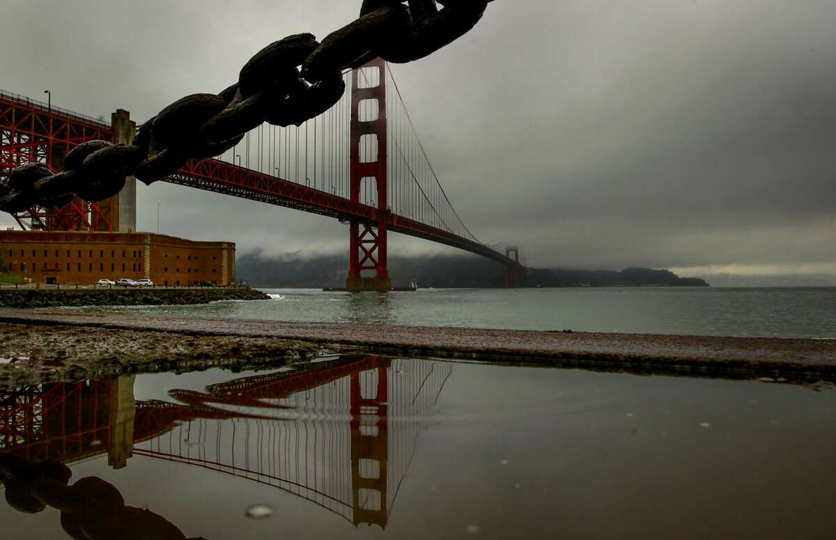 Clouds fill the sky above the Golden Gate Bridge during a light rain across San Francisco, California, on Wednesday November 30, 2016.