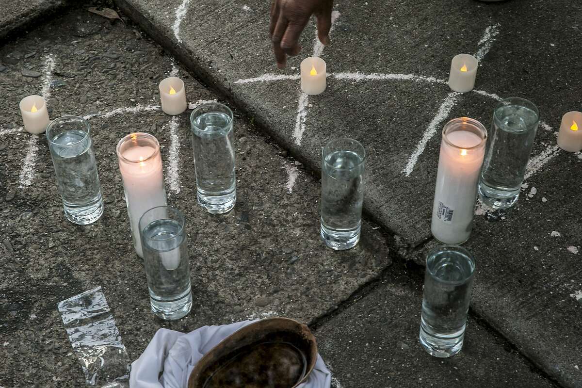 A memorial is seen at the site of Mario Woods' death, during an event commemorating the one-year anniversary of Woods' death, Friday, Dec. 2, 2016 in San Francisco, Calif.