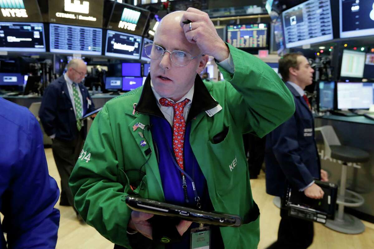 Trader Kevin Walsh works on the floor of the New York Stock Exchange, Friday, Dec. 2, 2016. U.S. stocks are mixed as a rally in oil prices and bank stocks fades. (AP Photo/Richard Drew)