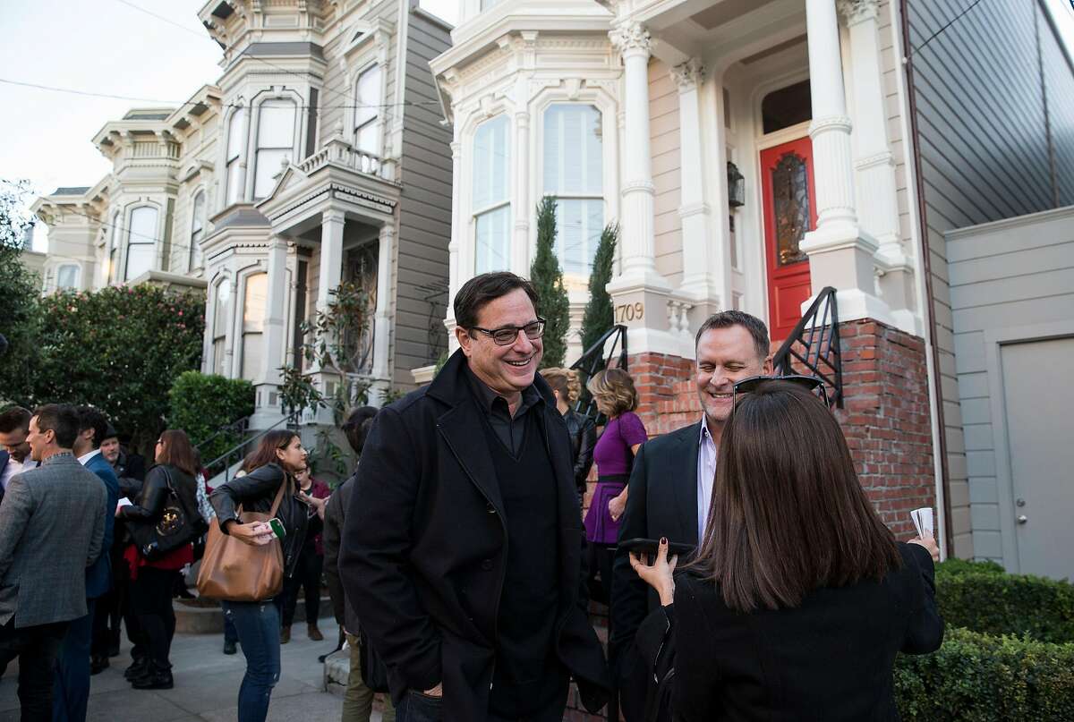 Bob Saget and his "Full House" cast mate Dave Coulier (right) are interviewed outside the property used in the sitcom as the home of the fictional Tanner family during a press event for the second season of the Netflix sequel "Fuller House" in San Francisco, Calif., on Friday, December 2, 2016. "Full House" creator Jeff Franklin recently purchased the property.