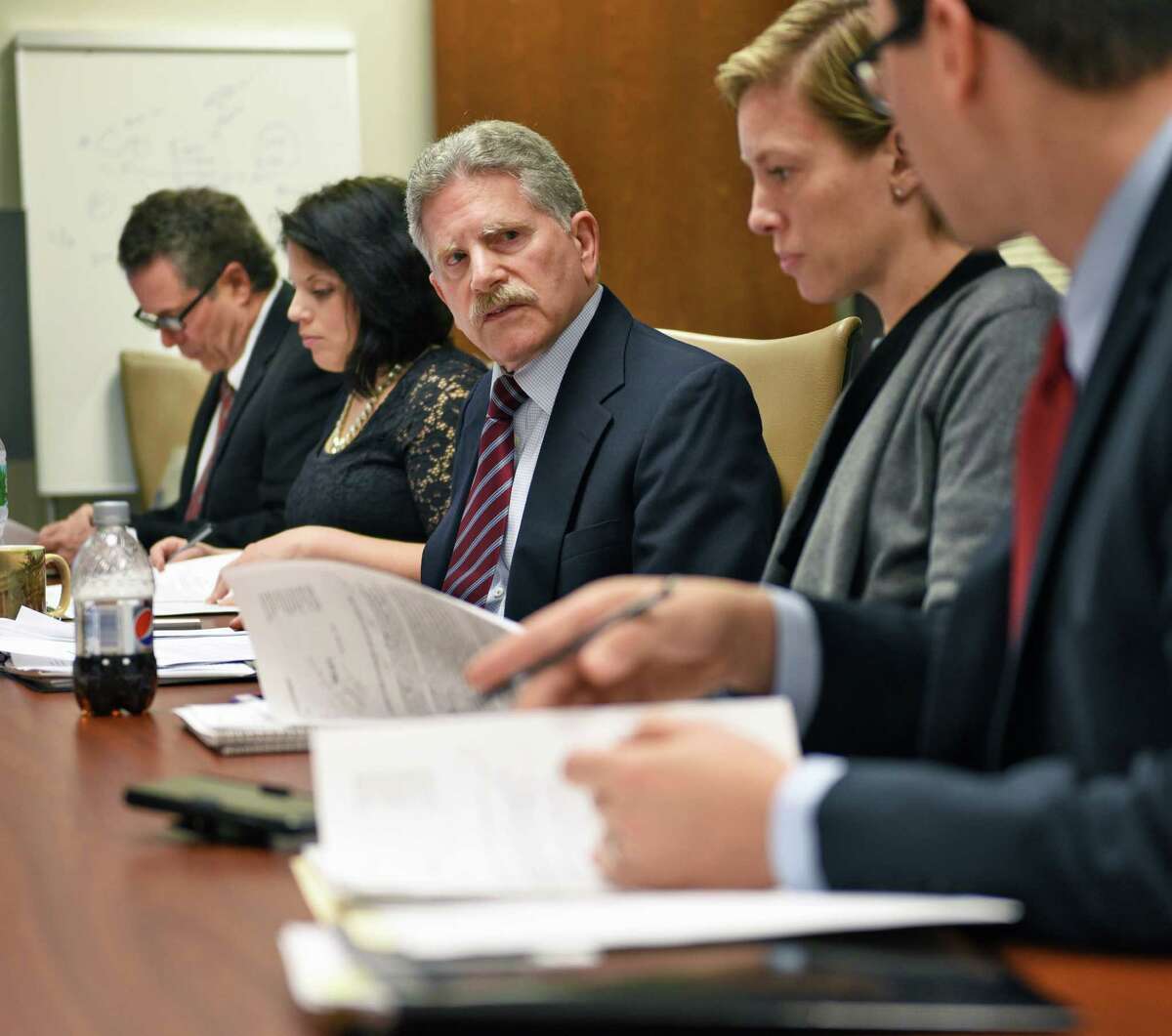 Executive director Robert Freeman, center, during the annual meeting of the NYS Committee on Open Government as it discusses it's annual report that will call for the repeal of a state law that prohibits the public disclosure of police officers' personnel records without a court order Wednesday Nov. 30, 2016 in Albany, NY. (John Carl D'Annibale / Times Union)