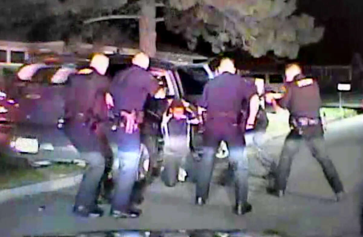 Frame grab from video showing Albany County sheriff's Sgt. Vincent Igoe Jr., using his Taser on a suspect who was on his knees with his hands on his head while surrounded by police. Igoe was suspended last month after sheriff's officials reviewed the video. (Albany County Sheriff's Department)