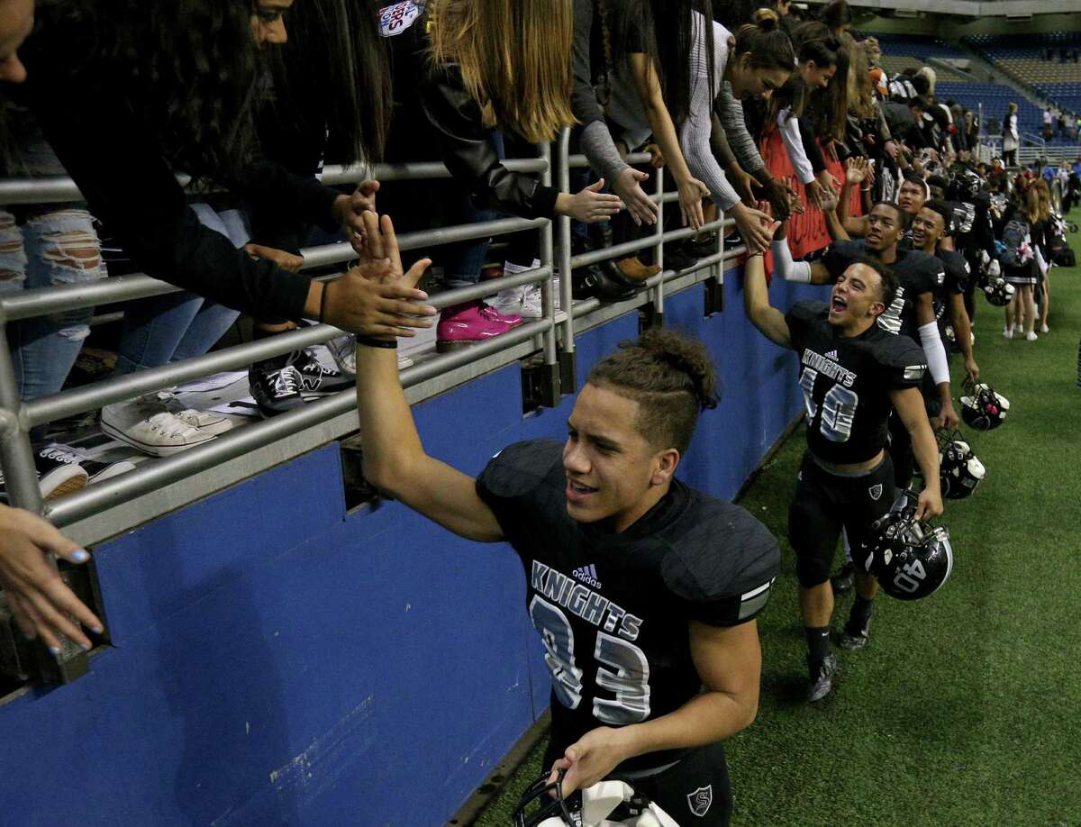 Members of the Steele Knights celebrate with fans after defeating Churchill 38-7 in their Class 6A Division II state quarterfinal playoff game held Saturday Dec. 3, 2016 at the Alamodome.