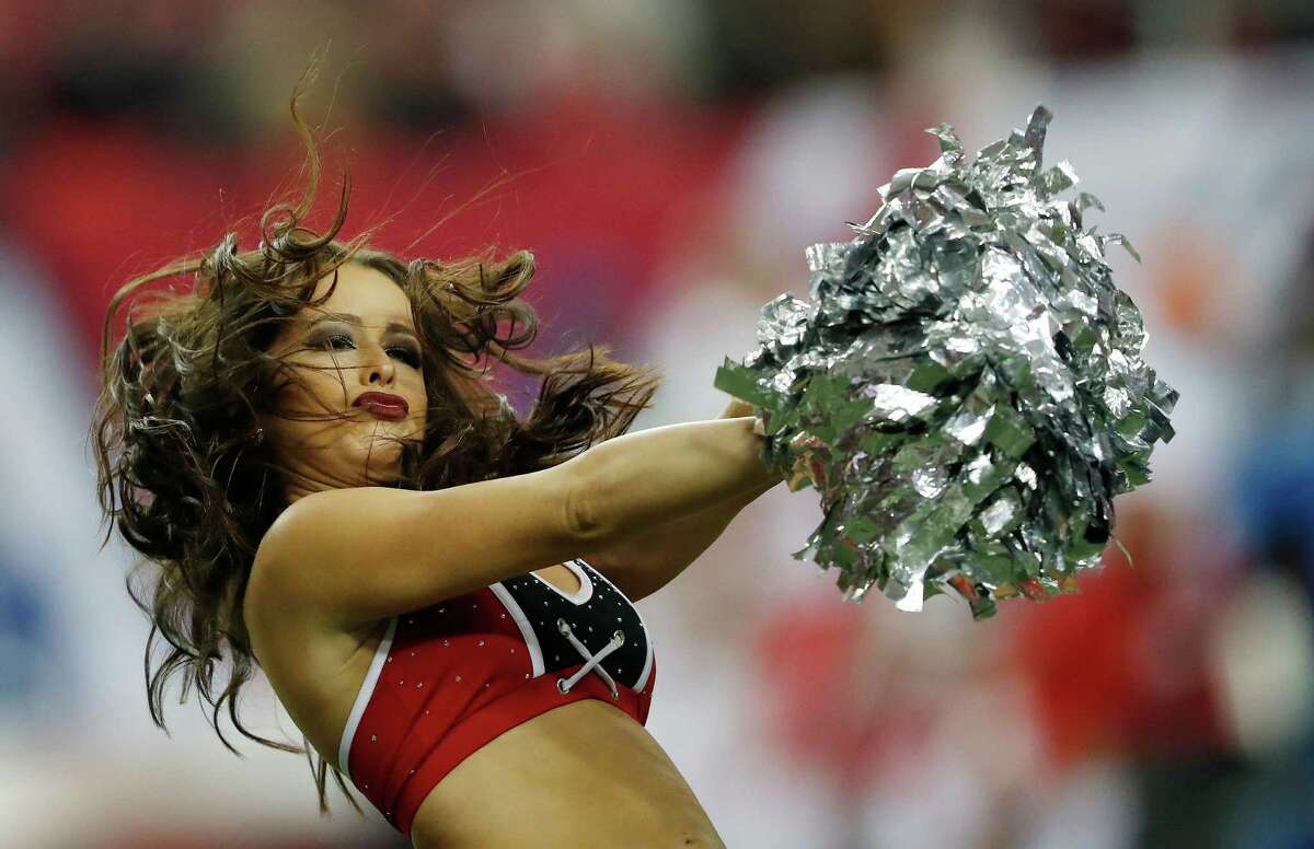 An Atlanta Falcons cheerleader performs during the second half of